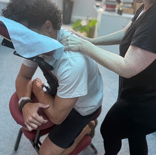 The Chill Chair therapist providing a seated massage